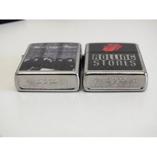 323 - TWO VINTAGE ROLLING STONES ZIPPO LIGHTERS- BOXED