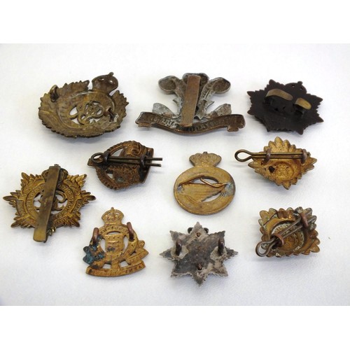 58 - TEN VARIOUS MILITARY BADGES