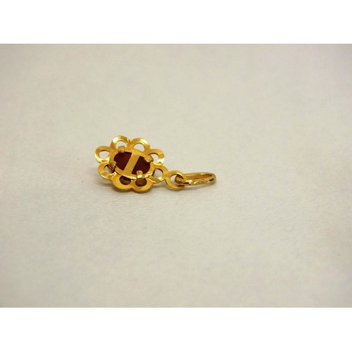 82 - FOUR 9ct GOLD CHARMS- 1.24g