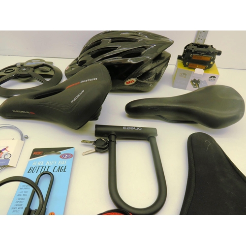 140 - SELECTION OF CYCLING ITEMS INCLUDES SEATS, HELMET, PEDALS AND LOCKS