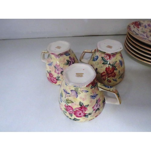 180 - WADE FLORAL PATTERN PART TEA SET COMPRISING OF TEAPOT, SIX CUPS and SAUCERS