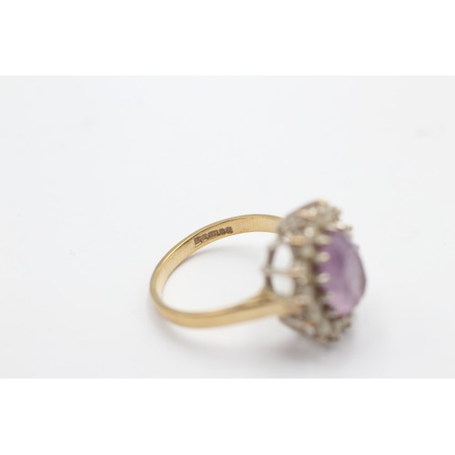 492 - 9ct gold amethyst & clear gemstone halo ring (4g) SIZE N