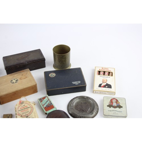 511 - 25 x Assorted TOBACCIANA Inc Ash Trays, Cigar Boxes, Brass Etc