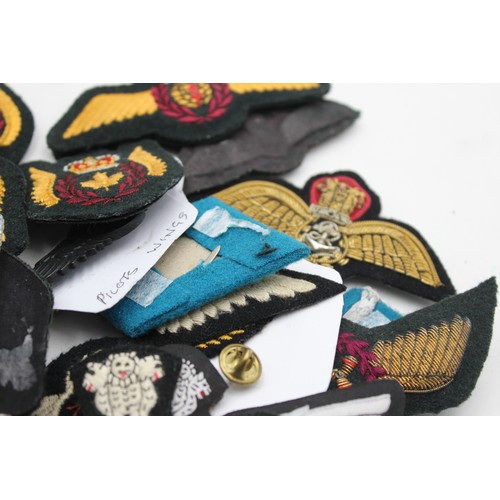 521 - 28 x Airforce Badges Inc Pilots Wings, Collar Tabs, Canadian, Saudi, Indian, Etc