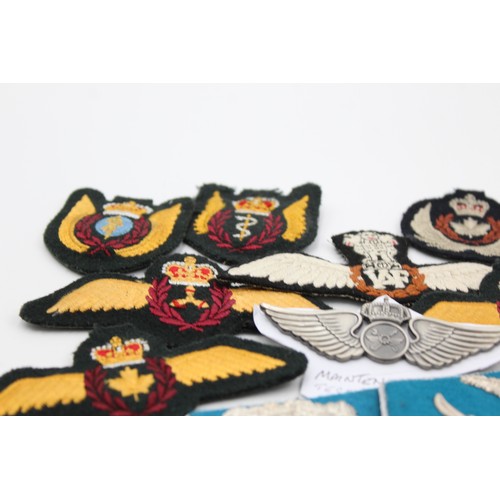 521 - 28 x Airforce Badges Inc Pilots Wings, Collar Tabs, Canadian, Saudi, Indian, Etc