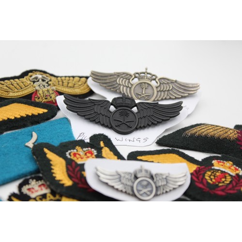 521 - 28 x Airforce Badges Inc Pilots Wings, Collar Tabs, Canadian, Saudi, Indian, Etc