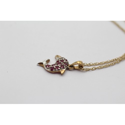 536 - 9ct gold diamond & ruby dolphin pendant necklace (0.9g)