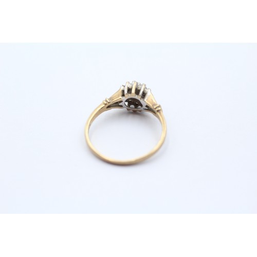 560 - 9ct gold diamond halo ring (1.7g) SIZE M