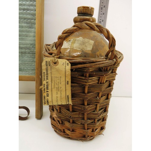 124 - VINTAGE FRENCH POLISH STONE BOTTLE IN BASKET AND VINTAGE GLASS WASHBOARD WITH TONGS