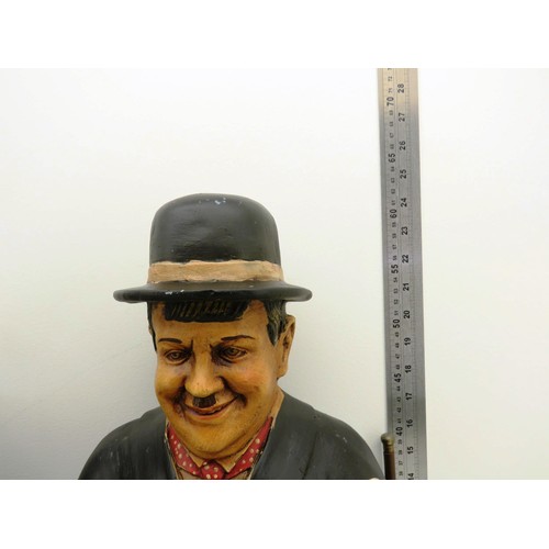 331 - LAUREL AND HARDY LARGE FIGURES ON METAL BENCH APPROXIMATE HEIGHT 25