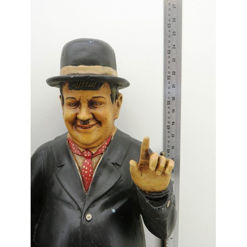 331 - LAUREL AND HARDY LARGE FIGURES ON METAL BENCH APPROXIMATE HEIGHT 25