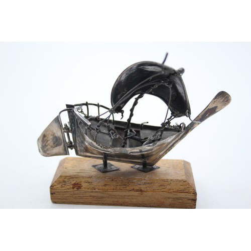 439 - Unmarked SILVER Ship Ornament with Wooden Stand (44g)