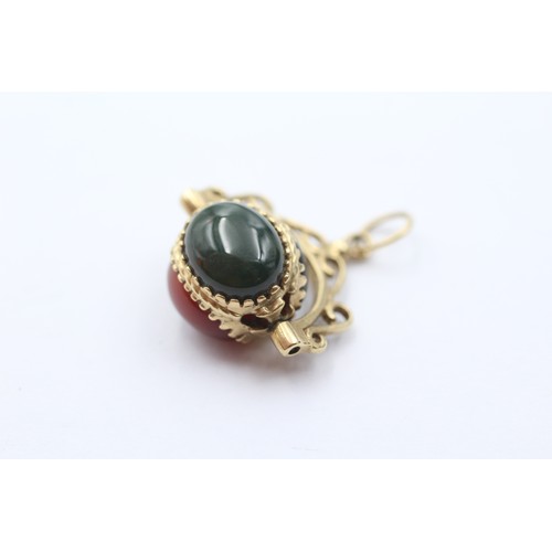 456 - 9ct gold onyx, bloodstone & carnelian swivel fob pendant (3.7g)