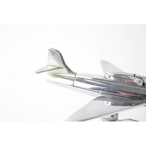 477 - 1950's Chrome Aviation Table lighter in the form of a Fighter Jet Modelled on a bakelite base