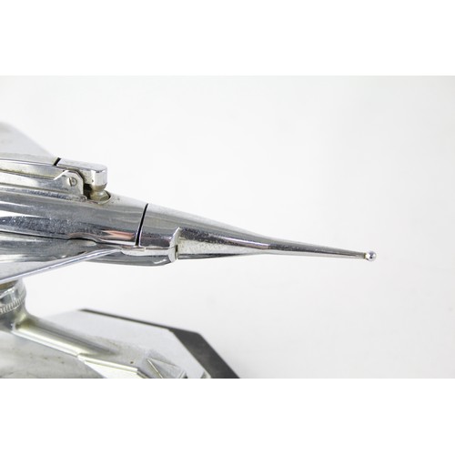 477 - 1950's Chrome Aviation Table lighter in the form of a Fighter Jet Modelled on a bakelite base