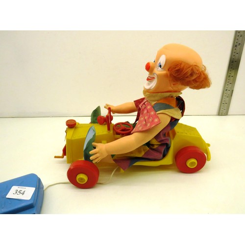 354 - VINTAGE PALITOY CLOWN TIPPY TUMBLES IN A CAR BATTERY OPERATED TOY IN VERY GOOD CONDITION