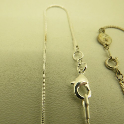 386 - STERLING SILVER PENDANTS AND CHAINS