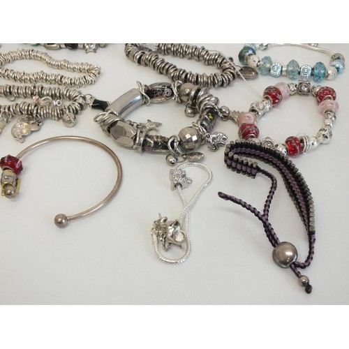 242 - 20 ASSORTED FASHION CHARM BRACELETS & NECKLACES