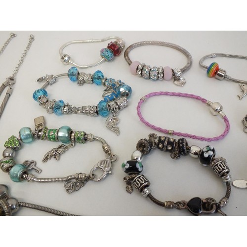 243 - 20 ASSORTED FASHION CHARM BRACELETS & NECKLACES