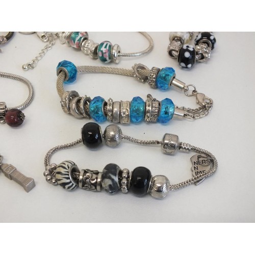 243 - 20 ASSORTED FASHION CHARM BRACELETS & NECKLACES