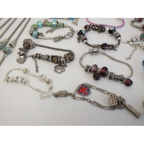 243 - 20 ASSORTED FASHION CHARM BRACELETS & NECKLACES