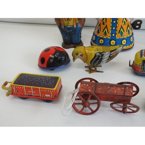 266 - NINE ORIGINAL VINTAGE TINPLATE TOYS INCLUDES KEY WIND LEHMANN LADYBIRD AND RUSSIAN MATRYYOSKA WIND U... 