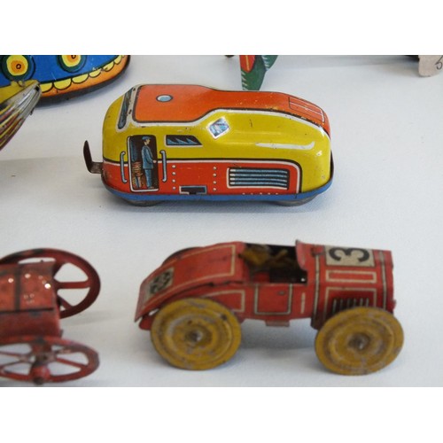 266 - NINE ORIGINAL VINTAGE TINPLATE TOYS INCLUDES KEY WIND LEHMANN LADYBIRD AND RUSSIAN MATRYYOSKA WIND U... 