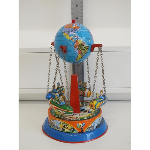 272 - PLANET ROCKET GO ROUND LEVER WIND TIN PLATE FAIRGROUND TOY