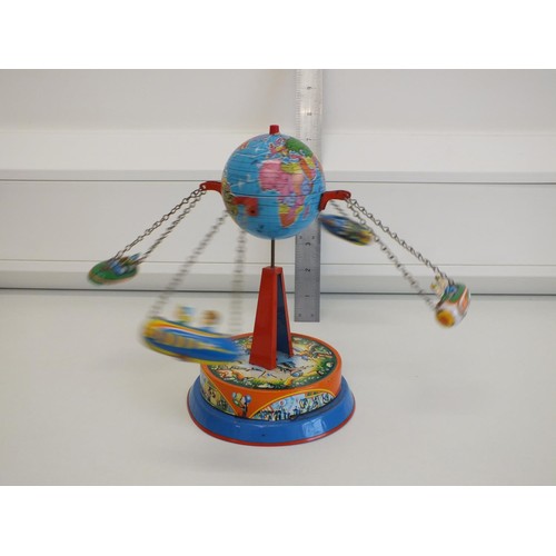 272 - PLANET ROCKET GO ROUND LEVER WIND TIN PLATE FAIRGROUND TOY