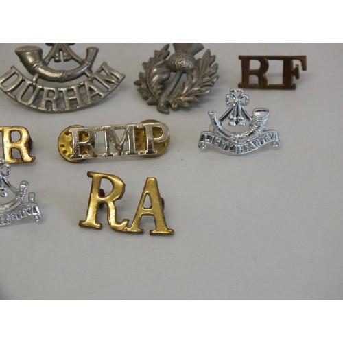 11 - BAG OF MILITARY SHOULDER TITLES