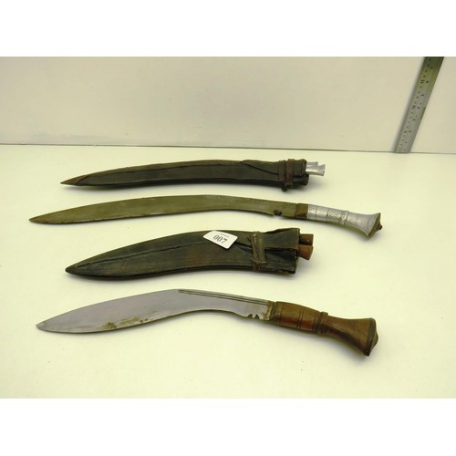 7 - TWO KUKRI KNIVES ONE WITH WOODEN HANDLE AND LARGE KUKRI