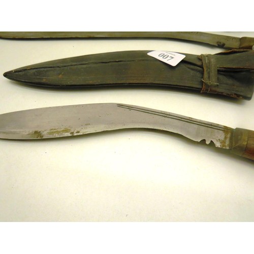 7 - TWO KUKRI KNIVES ONE WITH WOODEN HANDLE AND LARGE KUKRI