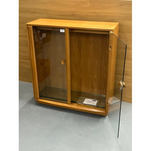 165 - ERCOL WINDSOR GLASS FRONTED DISPLAY CABINET WITH TWO GLASS SHELVES APPROX SIZE H39