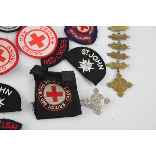 403 - Job Lot of British Red Cross, St John Ambulance Badges Inc Cloth & Metal, Etc