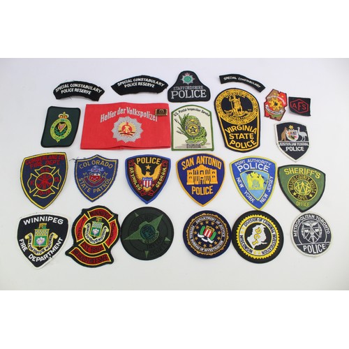 419 - Job Lot of Cloth Police & Fire Badges Inc USA, Canada, UK, Australia