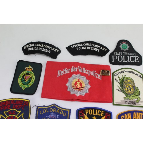 419 - Job Lot of Cloth Police & Fire Badges Inc USA, Canada, UK, Australia