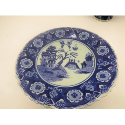 302 - ORIENTAL WILLOW PATTERN BLUE AND WHITE TRANSFER WARE CAKE STAND AND VASE