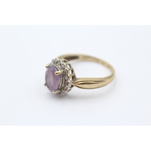 440 - 9ct gold diamond & amethyst oval halo ring (3g) size O