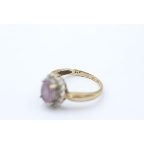 440 - 9ct gold diamond & amethyst oval halo ring (3g) size O