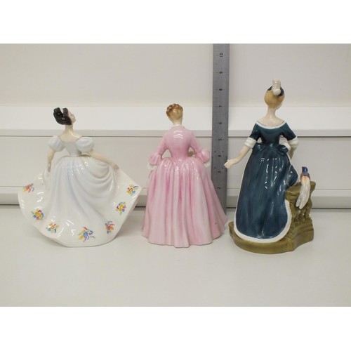 76 - THREE ROYAL DOULTON FIGURINES
A HOSTESS OF WILLIAMSBURG HN 2209
KATE H.N. 2789
CLARINDA H.N 2724 - D... 