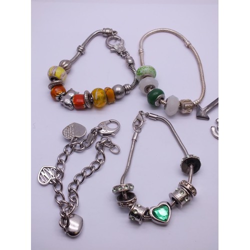 255 - SELECTION OF FASHION CHARM BRACELETS