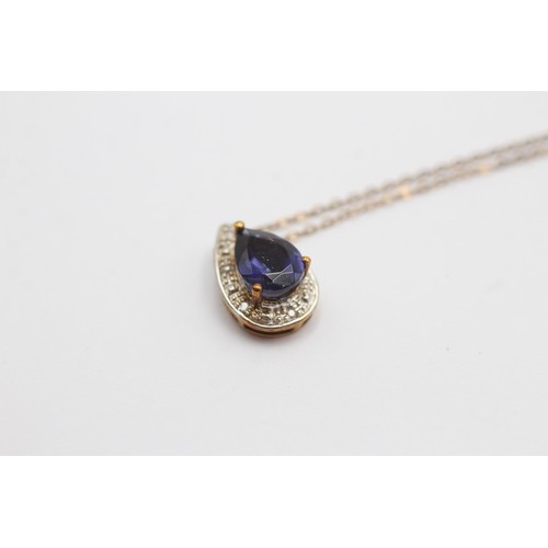 452 - 9ct gold diamond & iolite pendant necklace (1.8g)