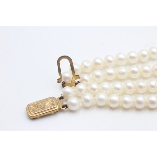 460 - 9ct gold clasp cultured pearl double strand necklace (43.6g)