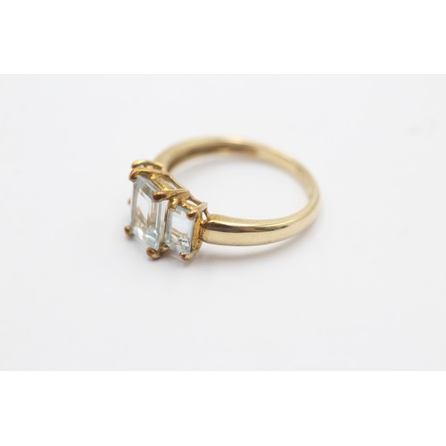 504 - 9ct gold aquamarine three stone ring (1.9g) SIZE J