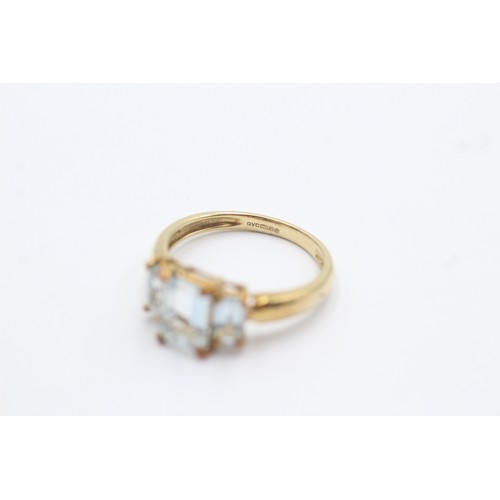 504 - 9ct gold aquamarine three stone ring (1.9g) SIZE J