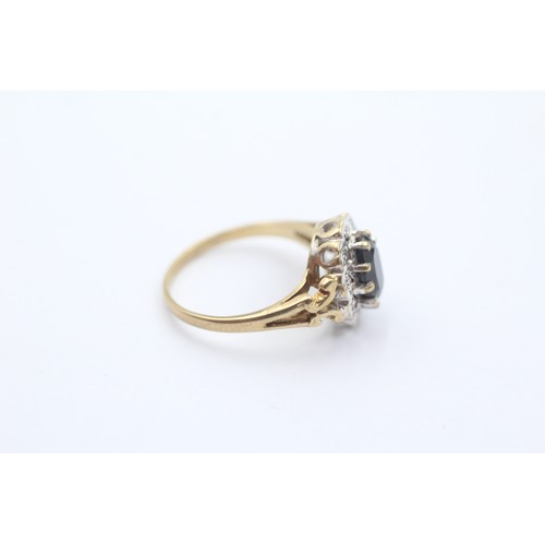 596 - 9ct gold diamond & sapphire oval halo ring (2g) SIZE J