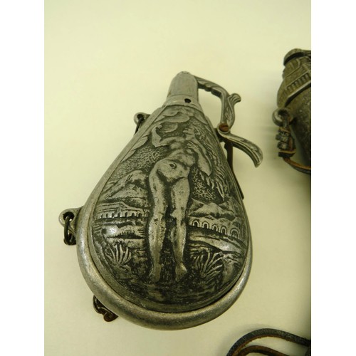 62 - MILITARY STYLE OLD BLACK METAL POWDER FLASK, METAL POWDER FLASK WITH NUDE LADY AND BEARDED MAN ANCIE... 