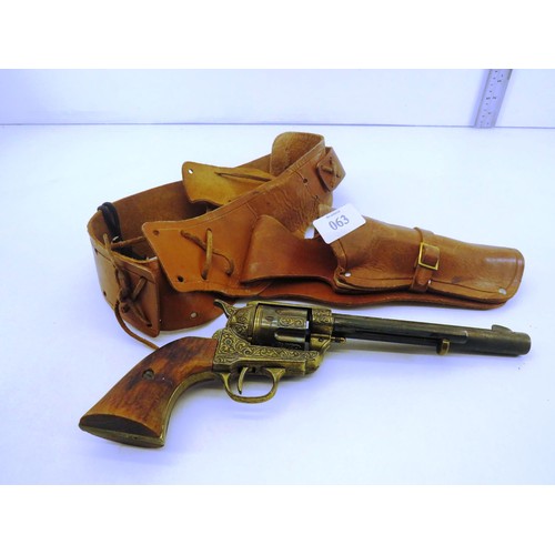 63 - REPLICA ENGRAVED COLT 45 PEACEMAKER WITH TAN LEATHER GUNBELT