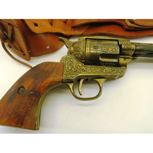 63 - REPLICA ENGRAVED COLT 45 PEACEMAKER WITH TAN LEATHER GUNBELT