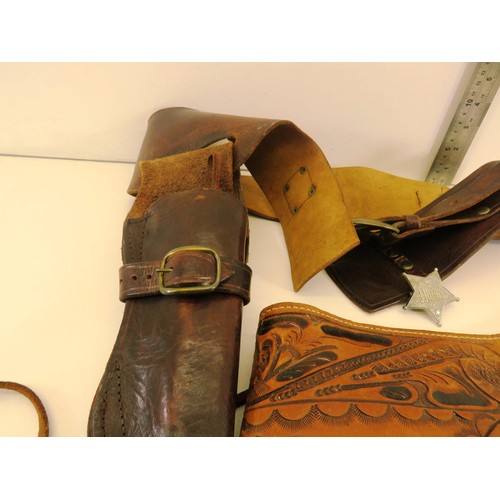 64 - TWO BROWN LEATHER GUN BELTS AND SHELL CASINGS BELT